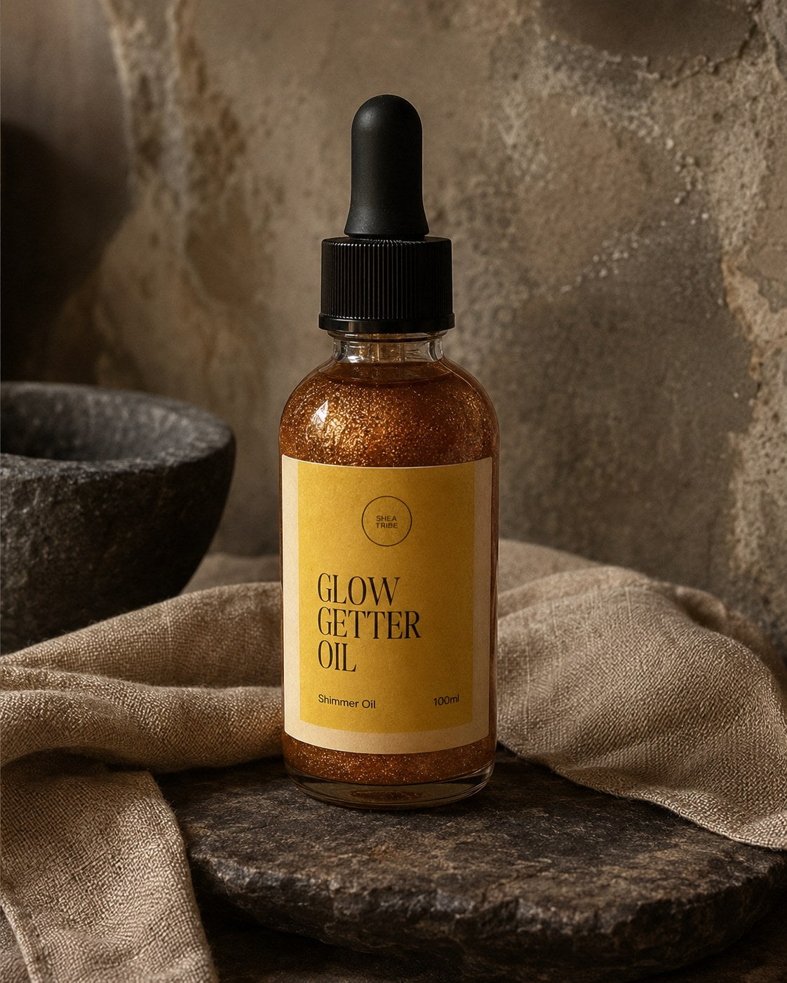 Glow Getter Oil by Shea Tribe, 100 ml shimmering body oil in a glass dropper bottle