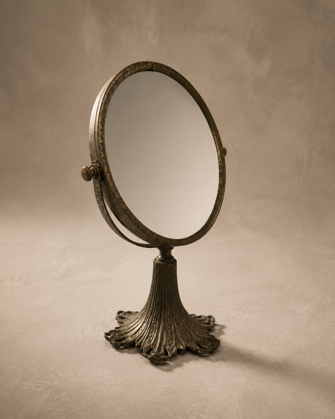 Antique Brass Vanity Mirror, oval tilting glass on a fluted, scalloped brass pedestal base
