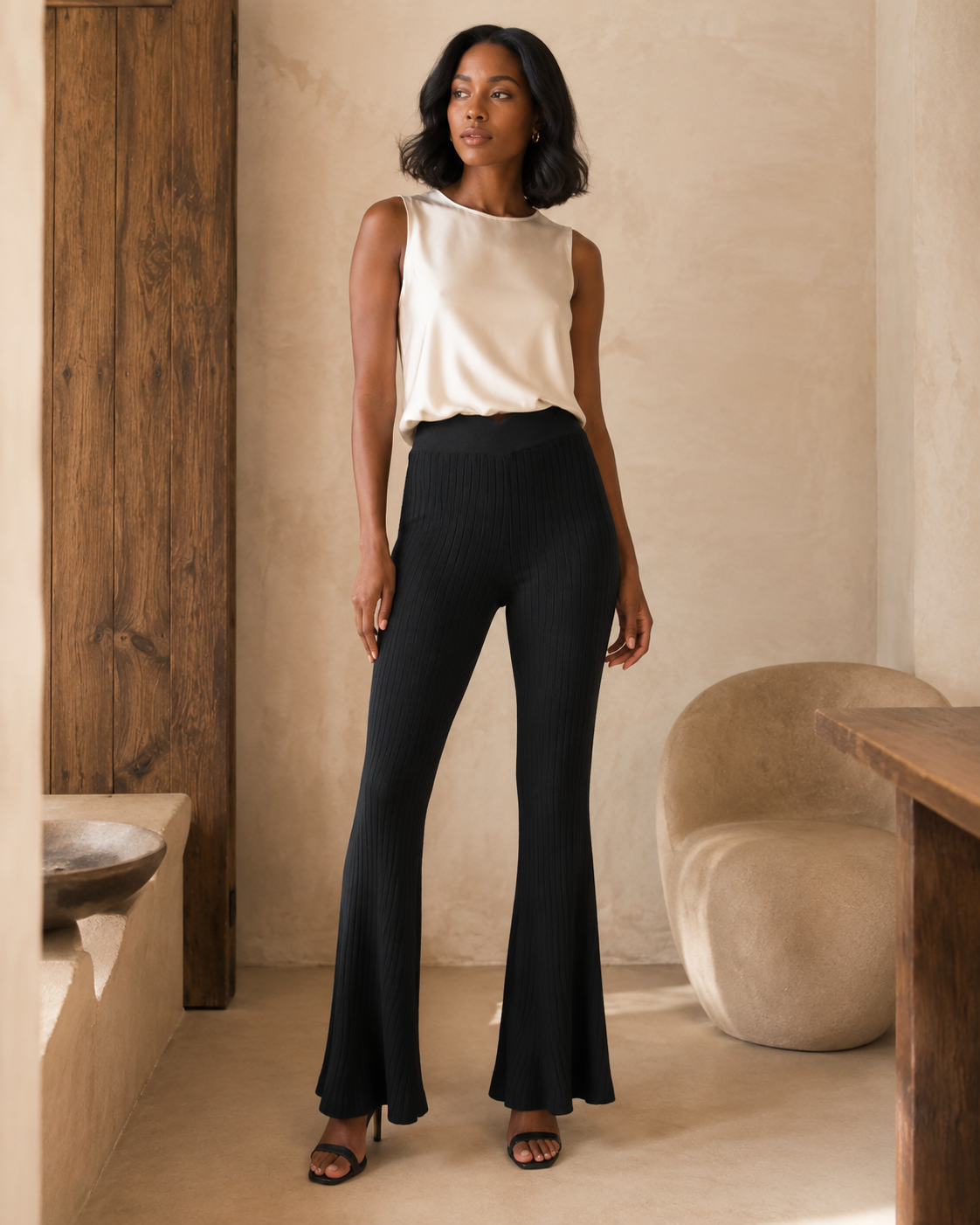 Black ribbed flare pants on model