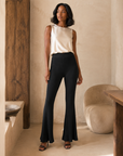 Black ribbed flare pants on model