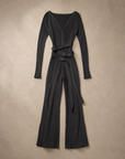 Black Ribbed Wrap Jumpsuit laid flat, long sleeves, deep V neck, tie waist and wide legs