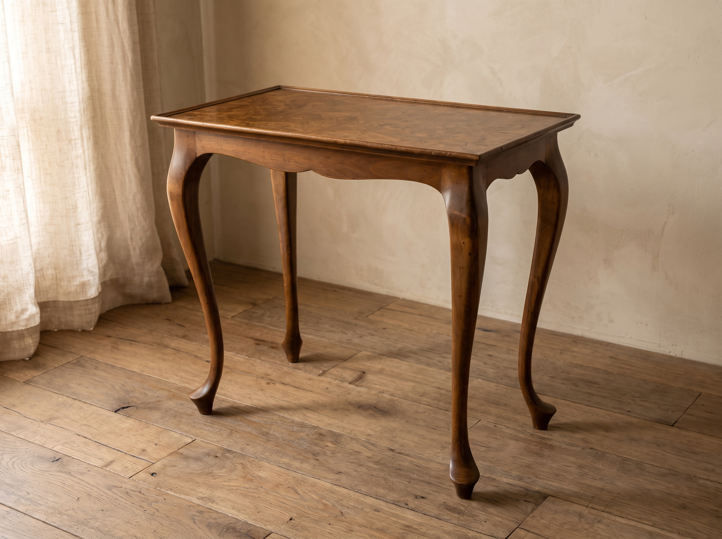 Three-quarter view of the burl walnut side table with cabriole legs