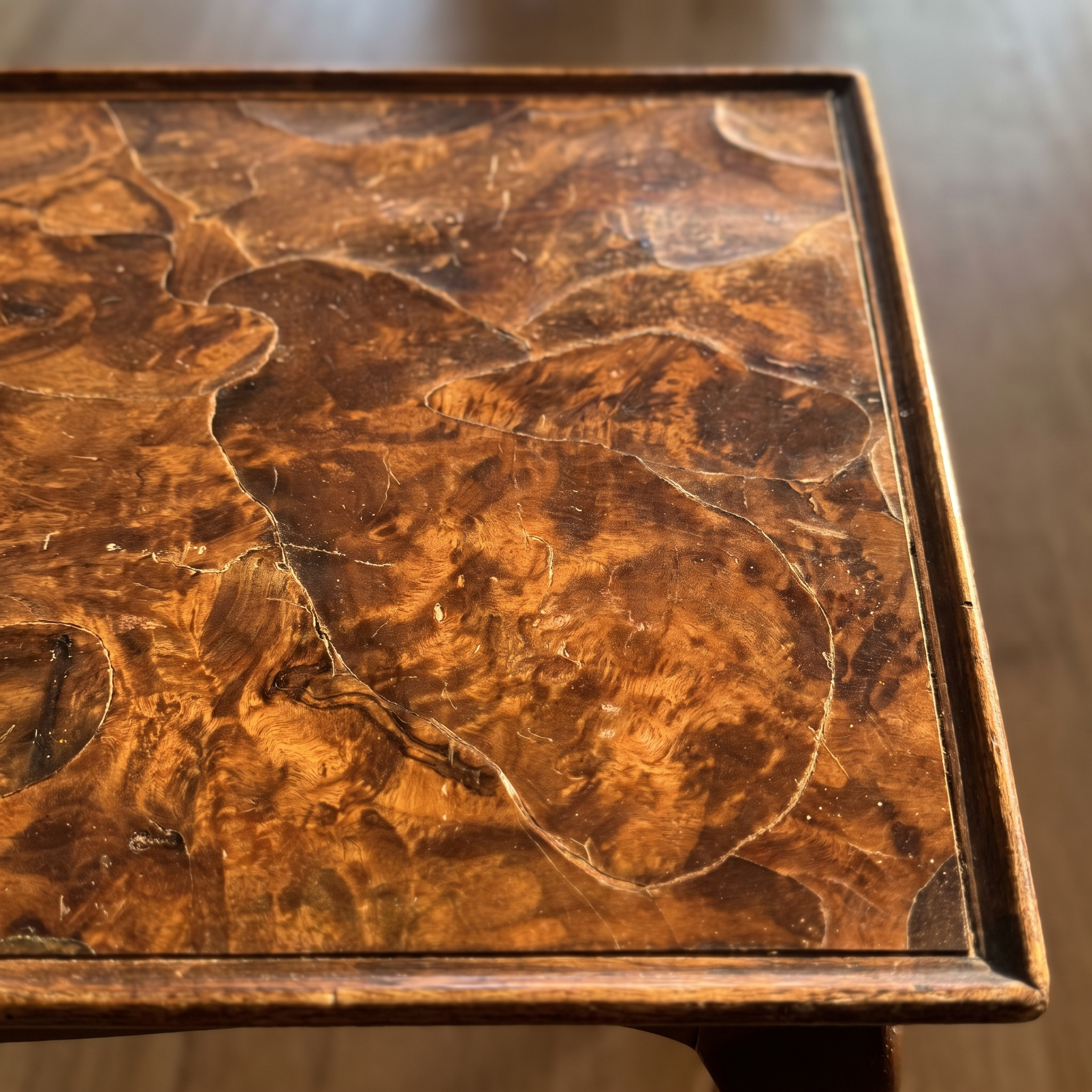 Macro detail of the oyster-cut burl walnut top