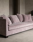 Three-quarter view of the dusty rose chenille sofa showing its full 86 inch length and low profile