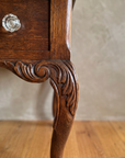 Antique writing desk, second leg and bracket detail angle