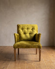 Chartreuse velvet diamond-tufted armchair, straight-on front view