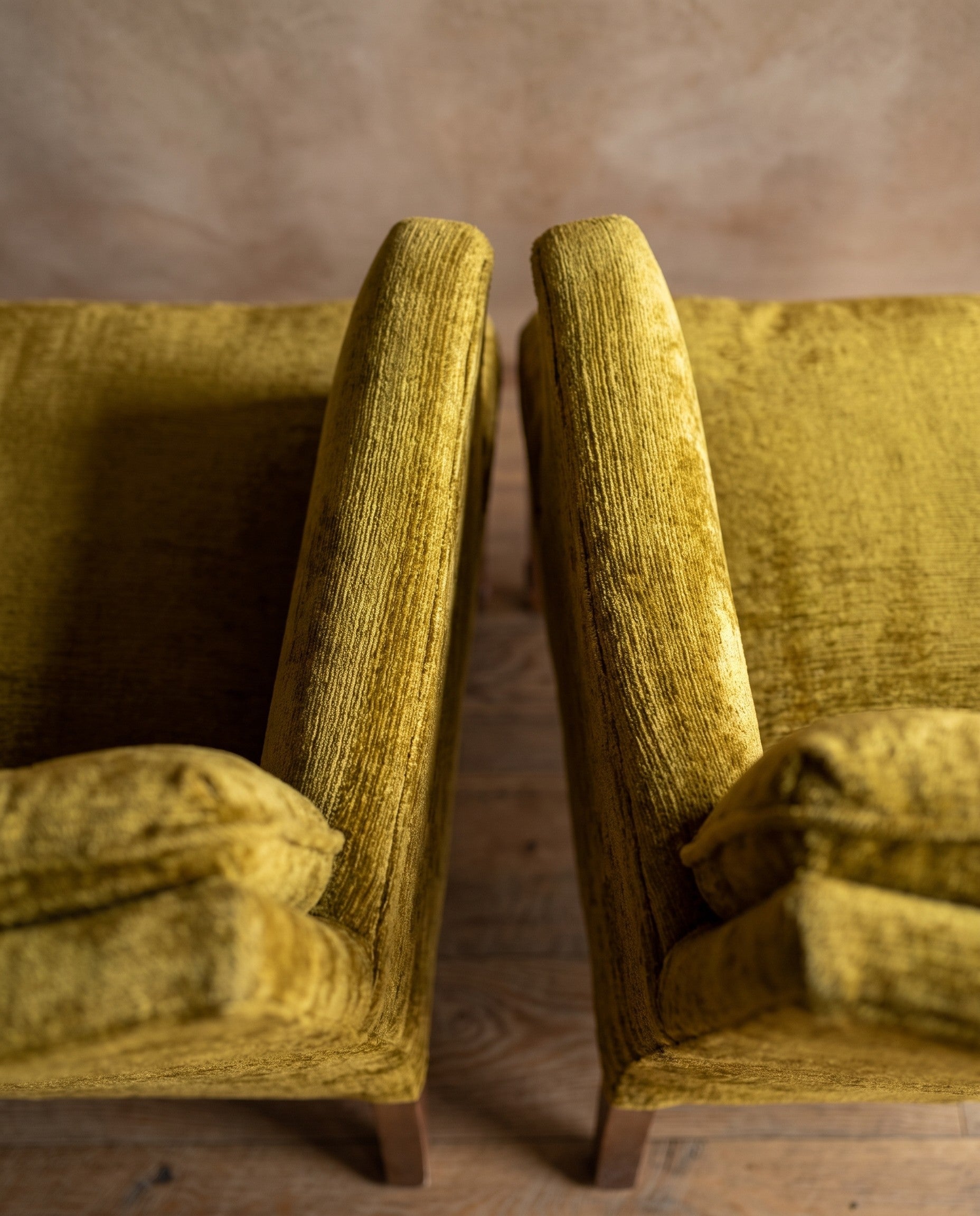 Chartreuse velvet diamond-tufted armchair, second overhead macro looking down both arm rails
