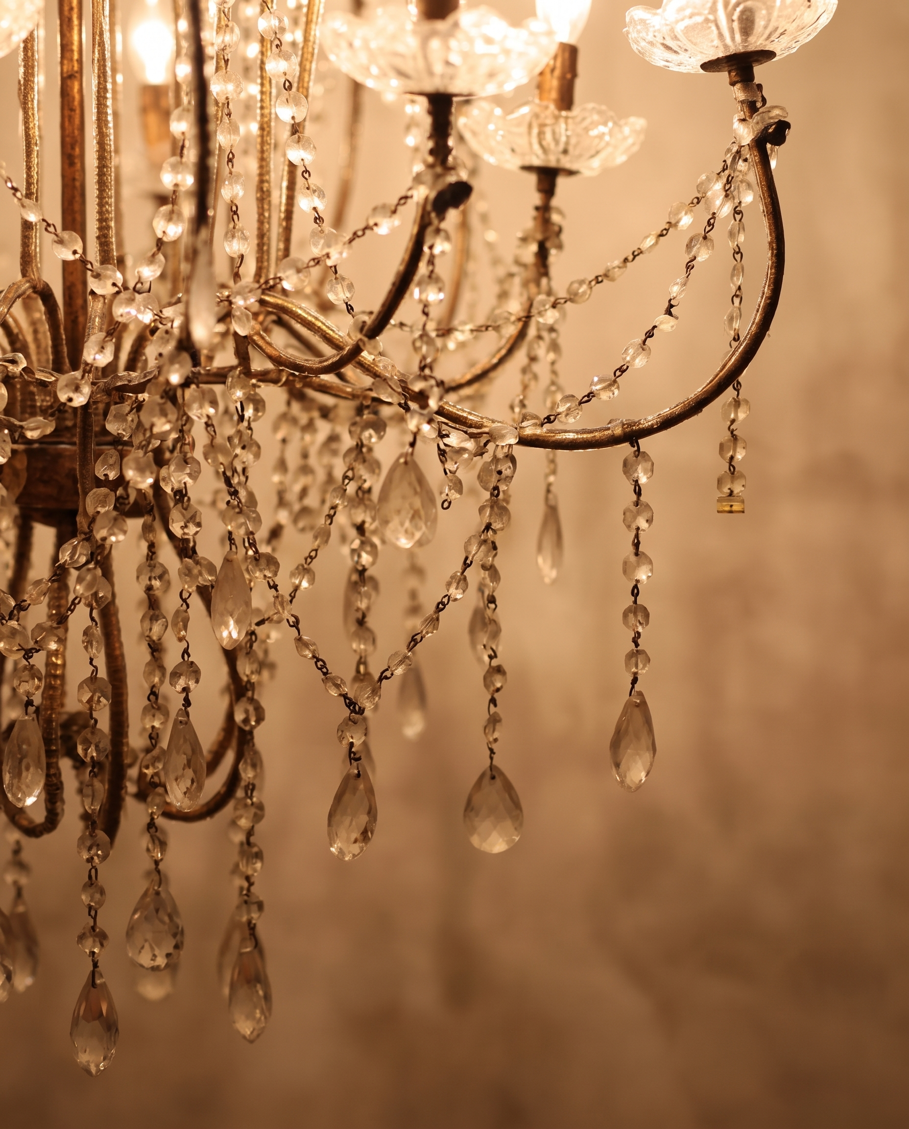 Macro detail of beaded crystal strands and faceted rock-crystal drop pendants