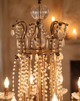 Detail of the fluted cut-glass ball finial and gilt beaded crown