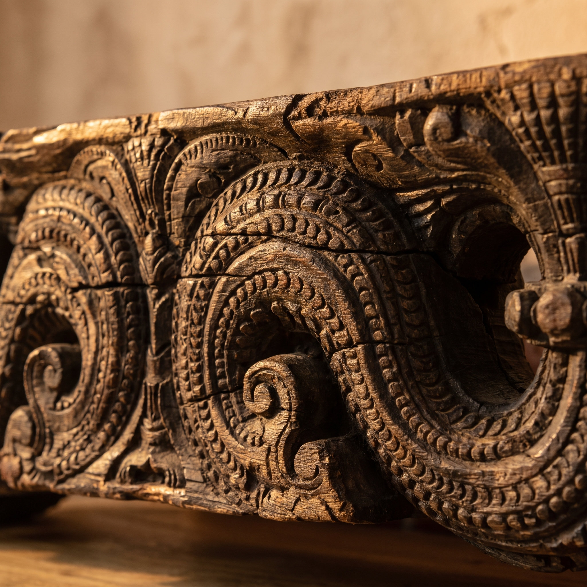 Close-up of the hand-carved scroll and wave carving