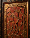 Detail of the hand-carved gilded plum-blossom door panel
