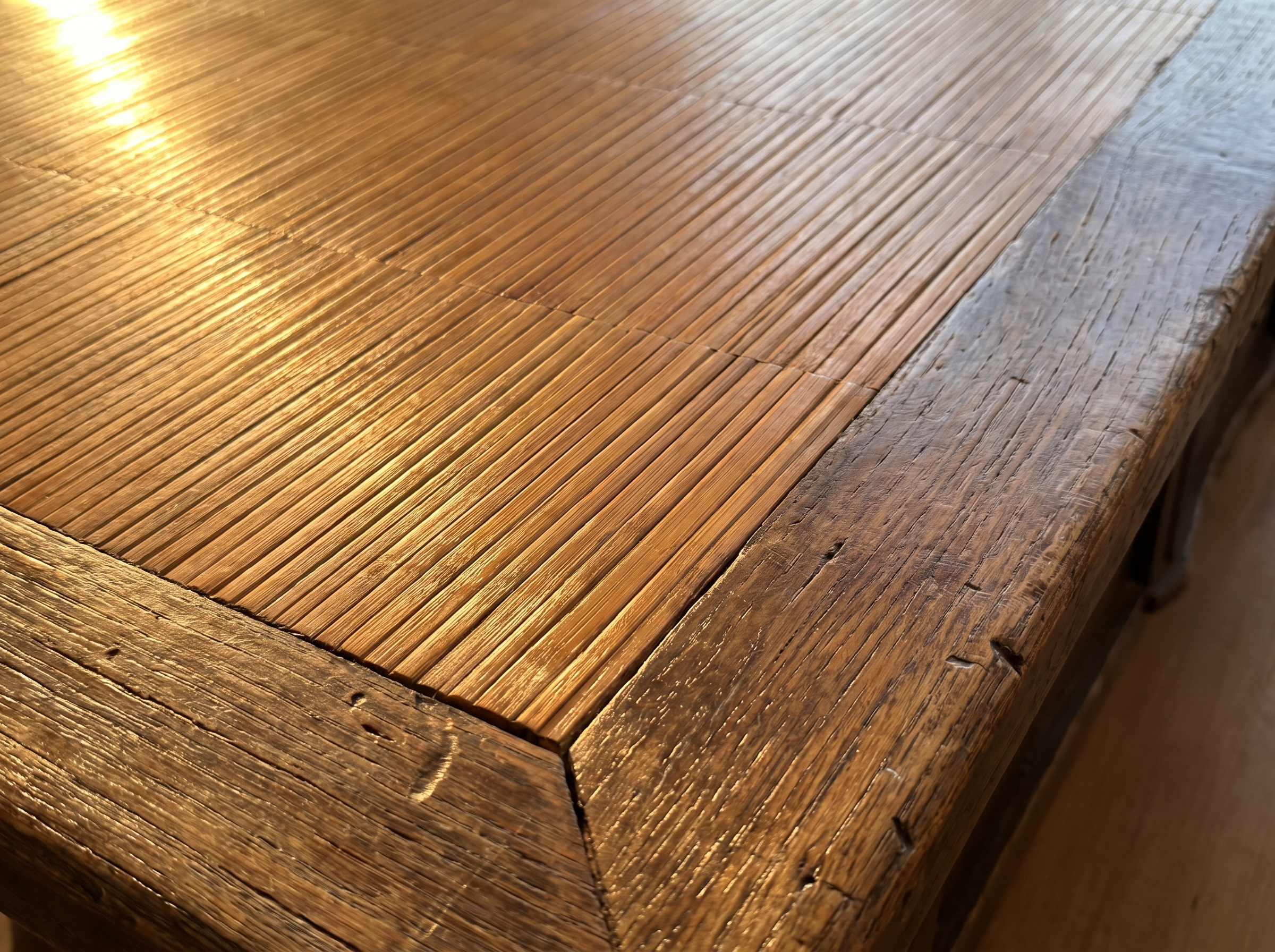 Macro detail of the honey bamboo-strip top and worn elm border