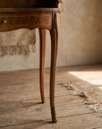 Cabriole leg detail with ormolu knee mount and brass foot