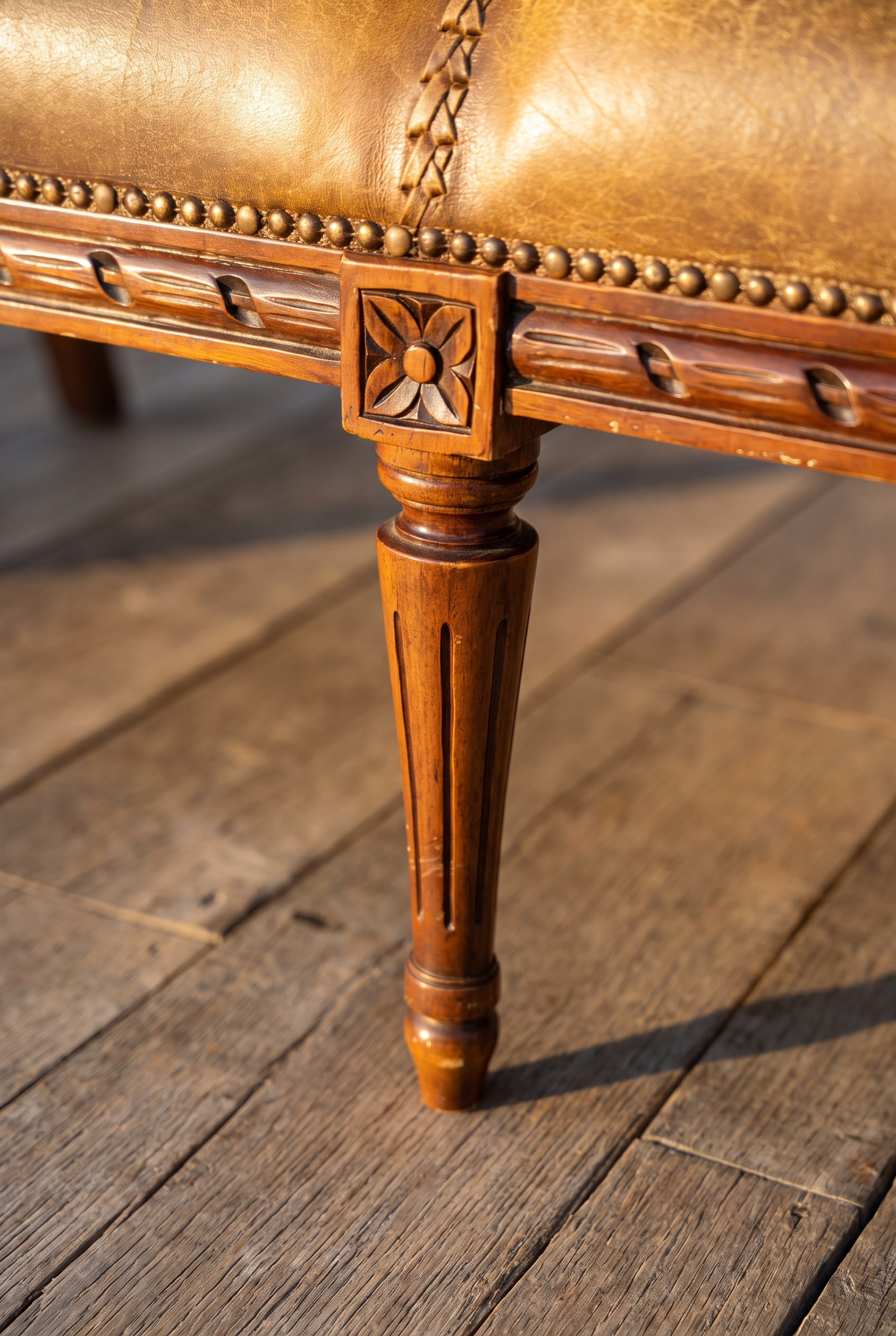 Detail of the carved rosette leg block and fluted Louis XVI tapered leg