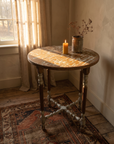 The Little Maison Table styled by a linen-curtained window in warm afternoon light