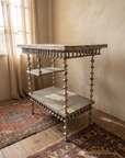 Antique spool table, three-quarter view showing both shelves
