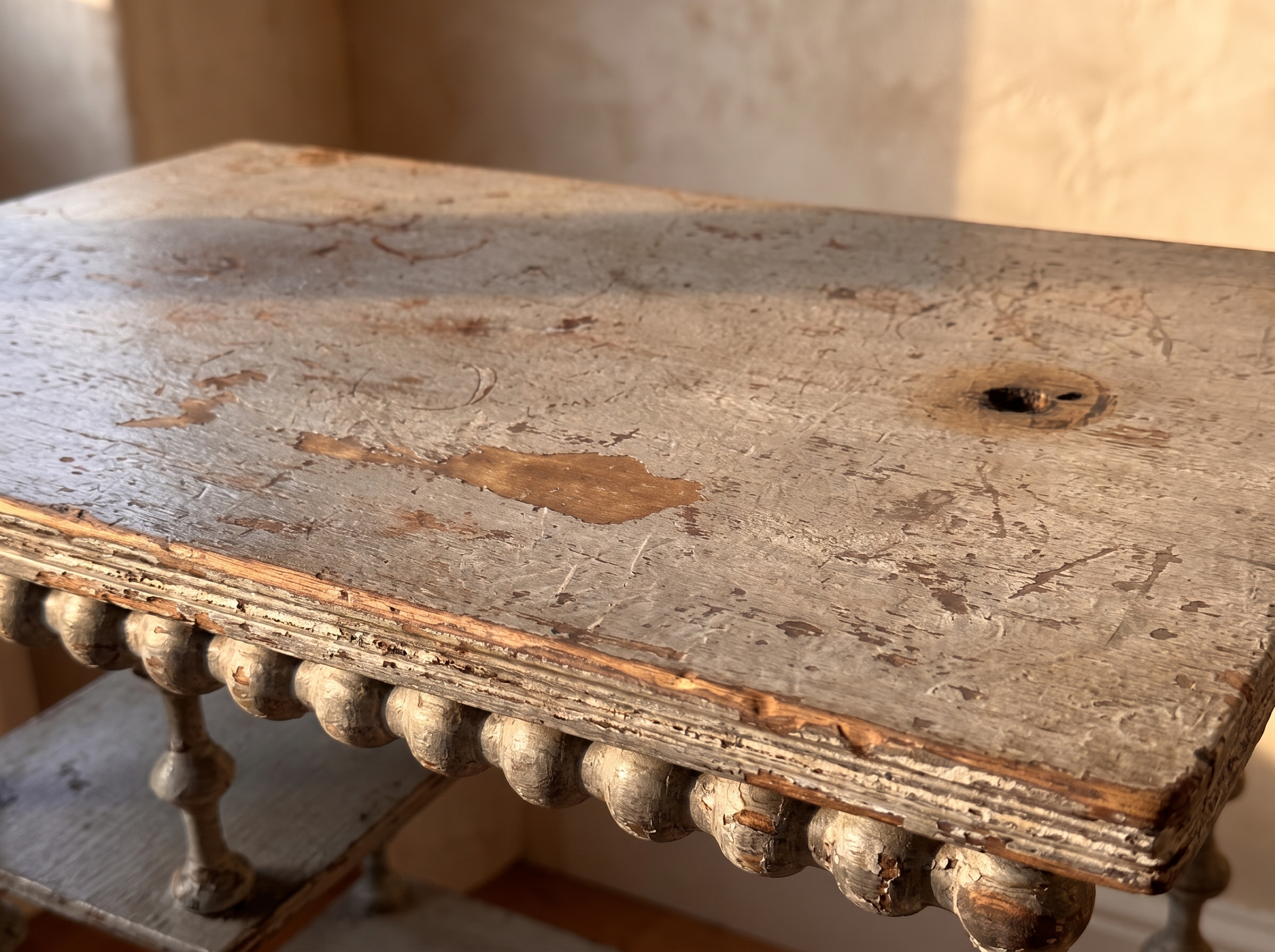 Antique spool table, worn painted top detail
