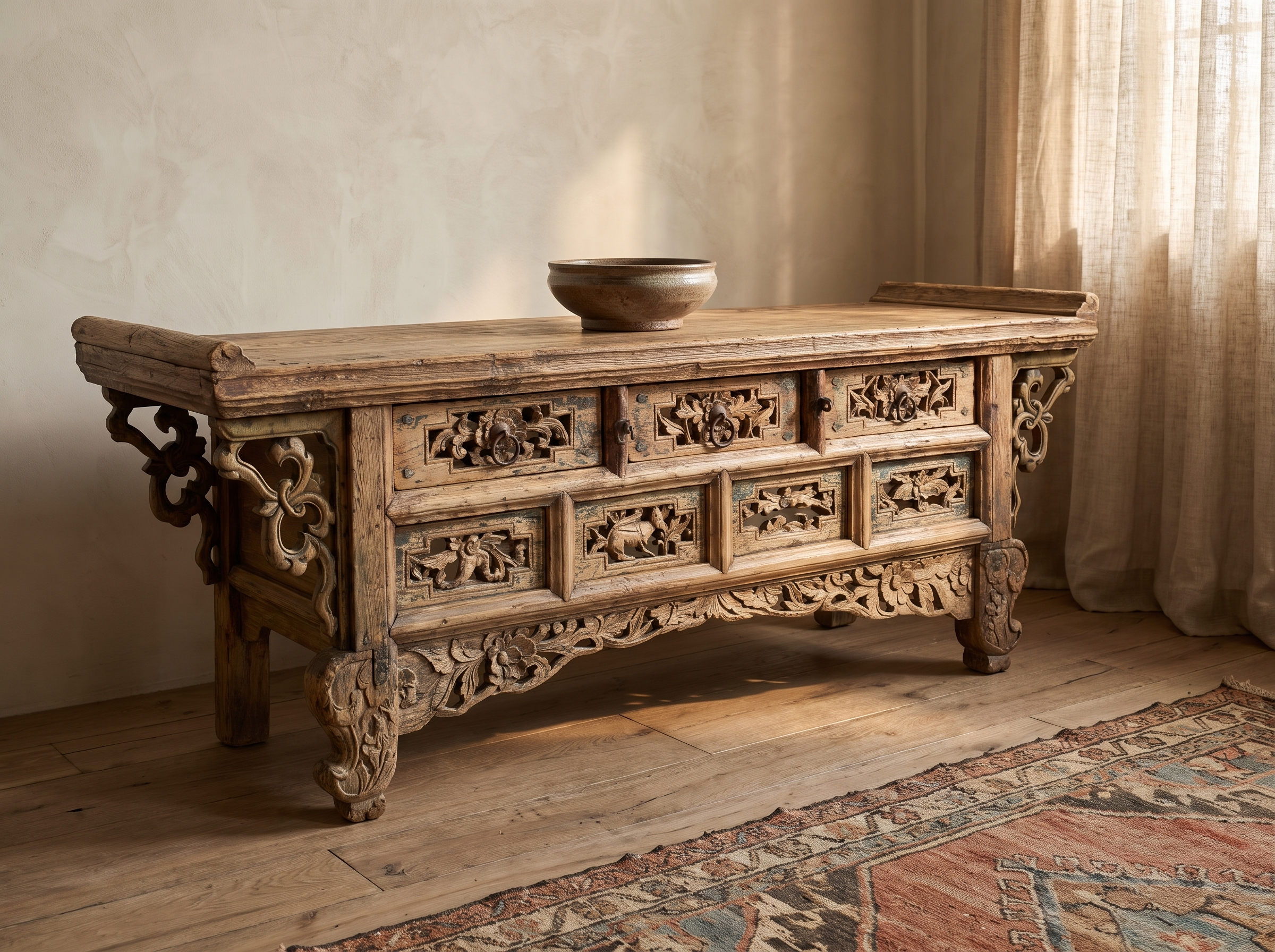 Long three-quarter view showing the full carved front and everted flanged ends of the altar table