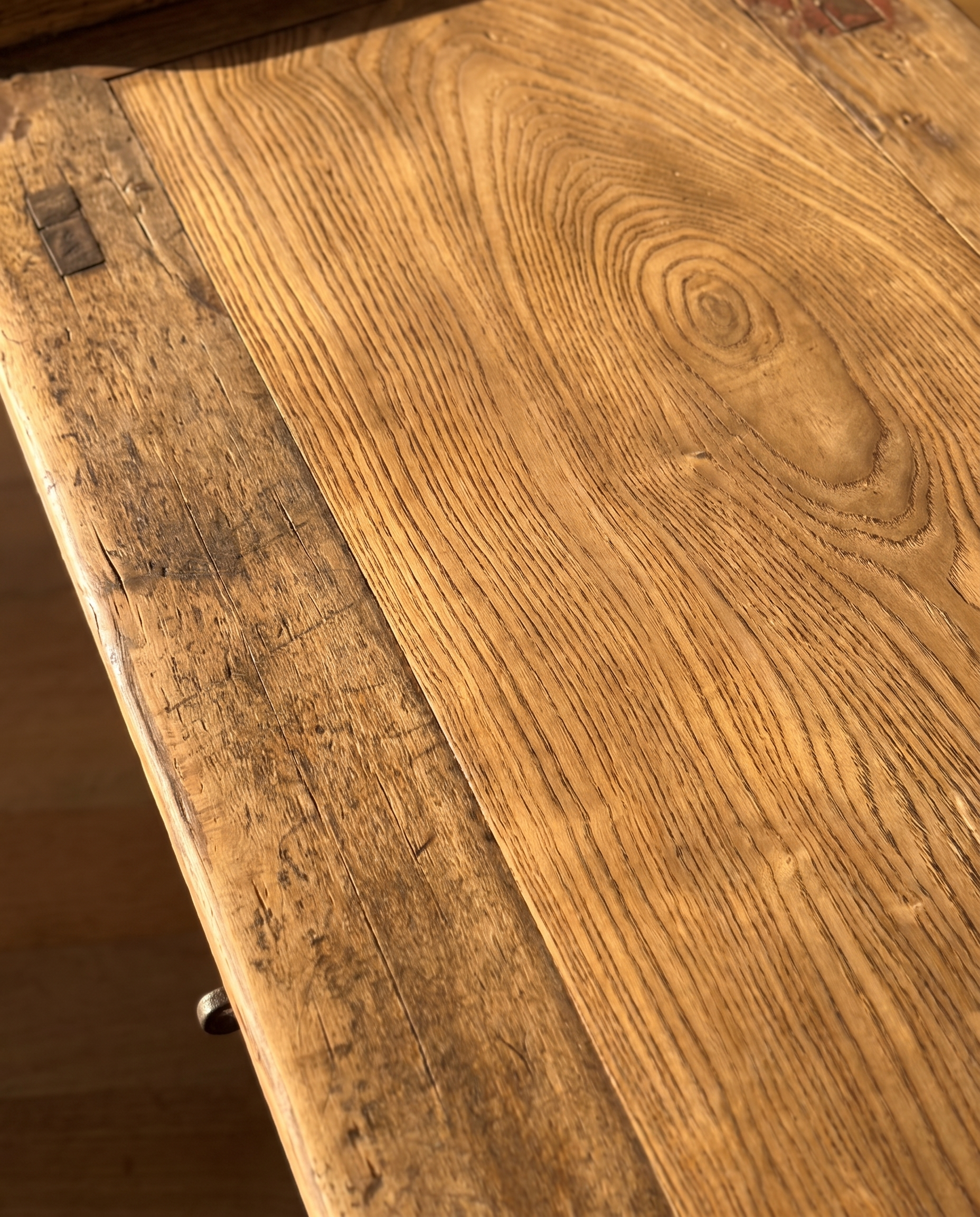 Macro of the elm tabletop grain with an old iron repair bracket