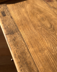 Macro of the elm tabletop grain with an old iron repair bracket