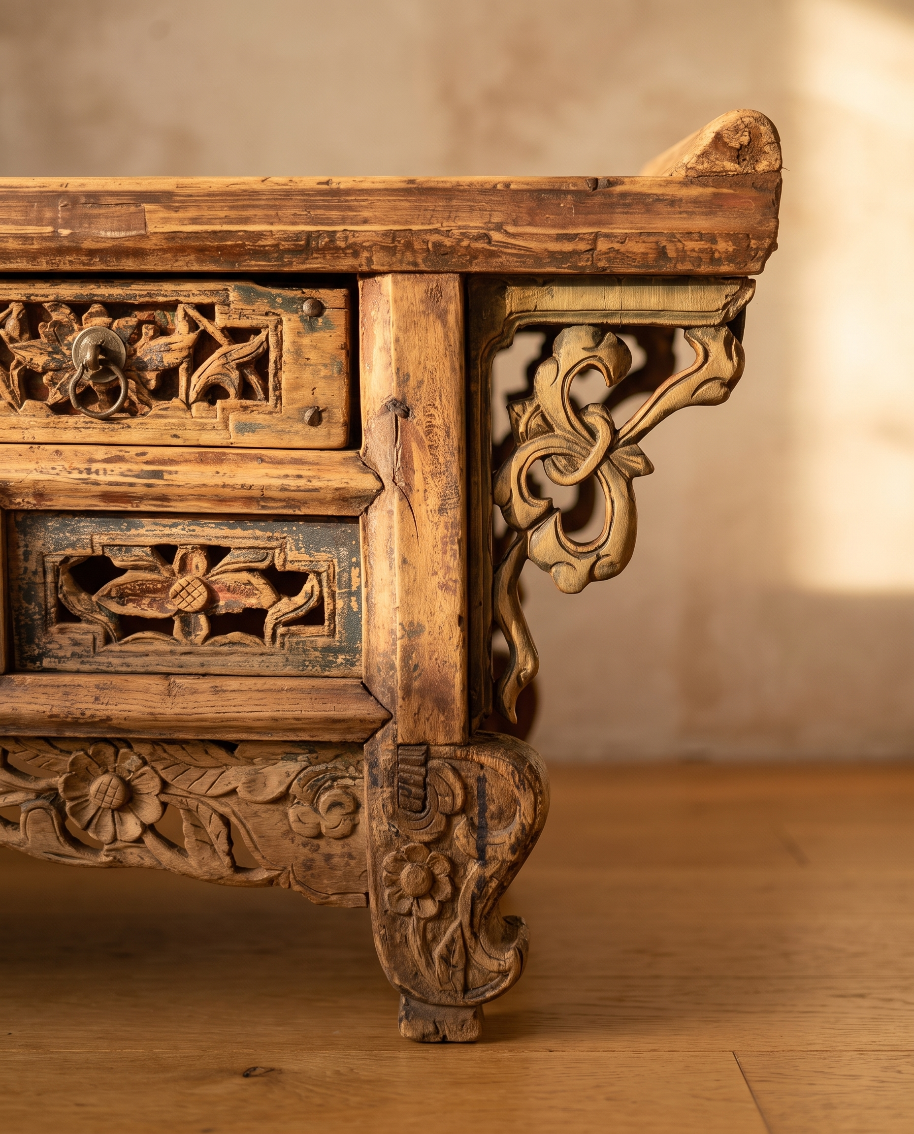 Detail of the carved ruyi-scroll corner bracket and scrolled carved foot