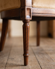 Detail of the reeded tapered mahogany front leg