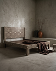 Bone Inlay Bed, three-quarter view showing full silhouette and leg construction