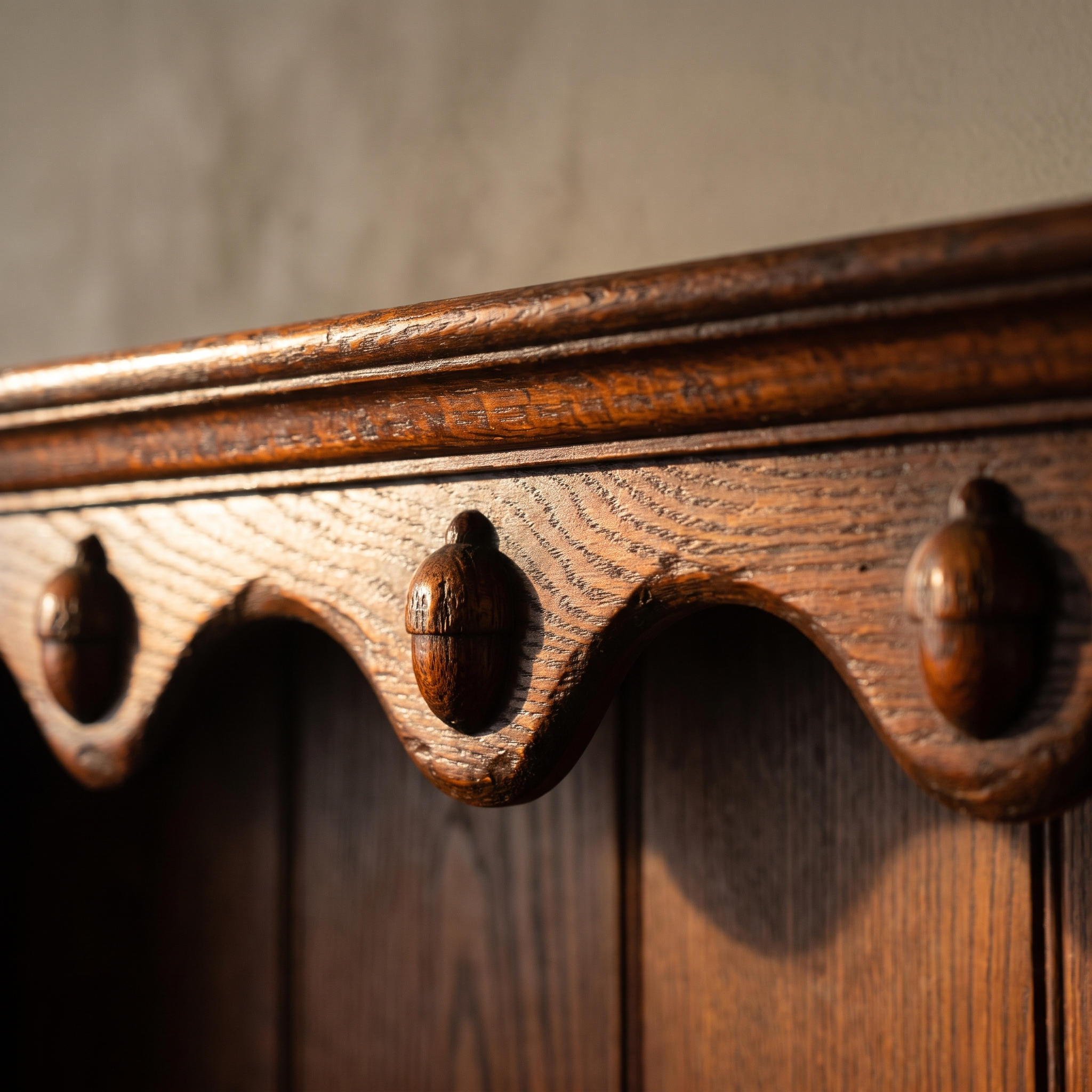 Detail of the carved acorn scallop valance on the antique oak dresser