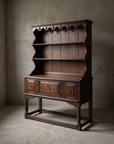 Three-quarter view of the antique oak Welsh dresser alone in the room, full form and construction visible