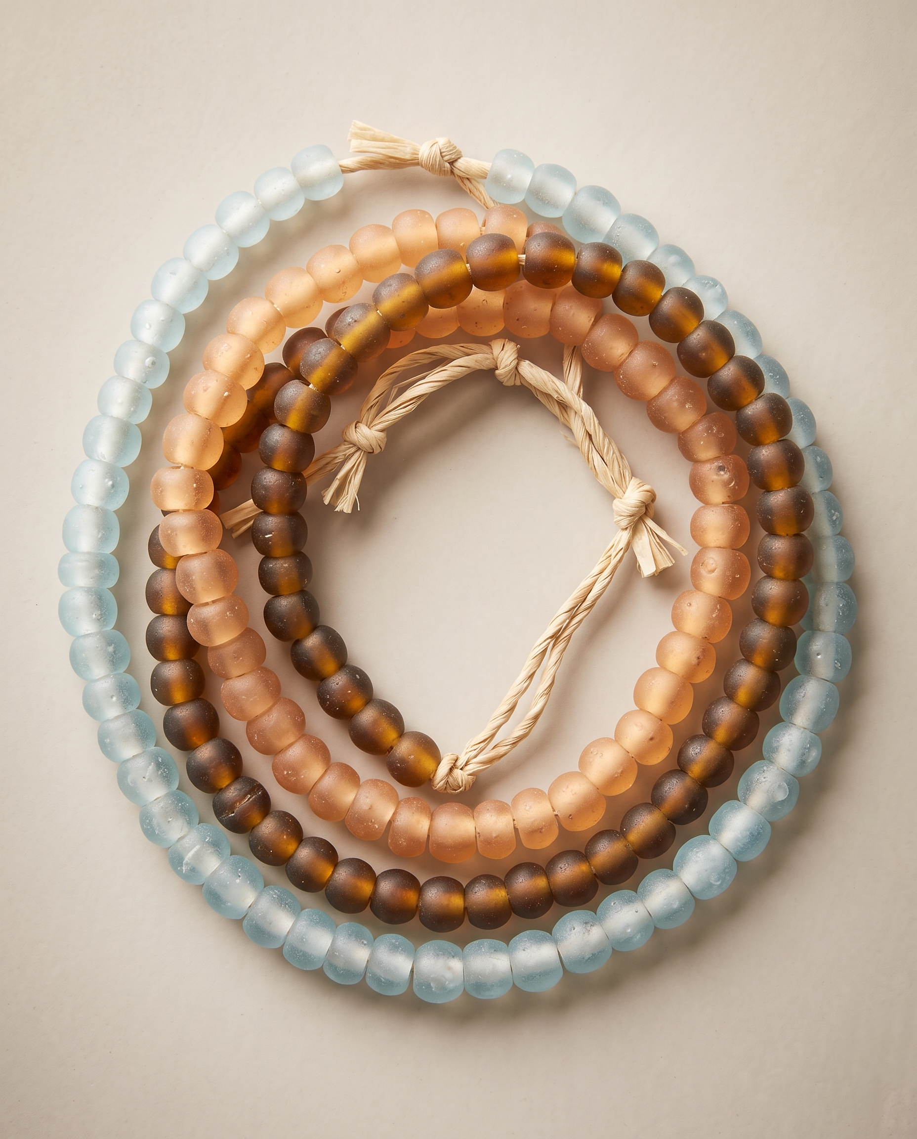 African recycled glass beads, mixed assortment - aqua, peach and smoky amber strands