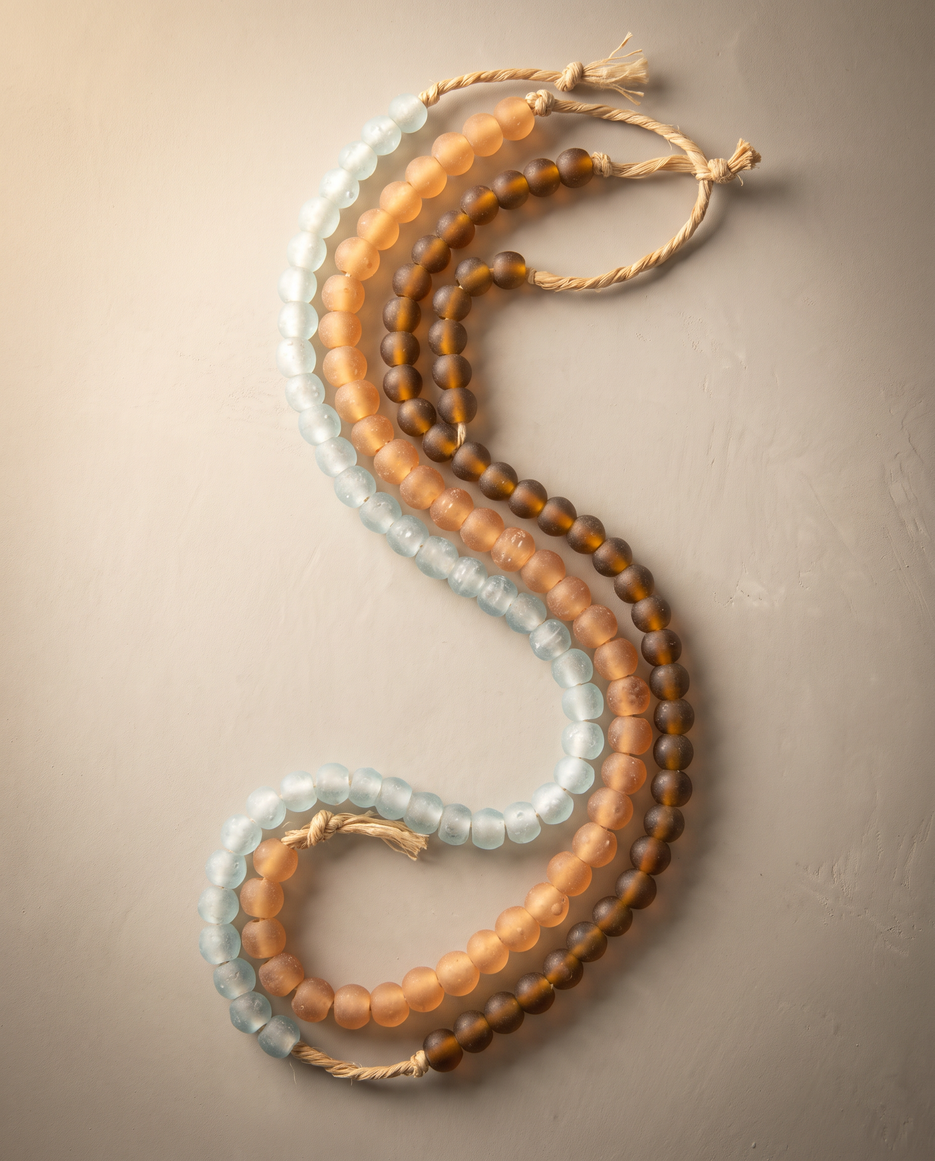 African recycled glass beads, mixed assortment - three strands laid in parallel curves