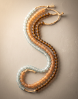 African recycled glass beads, mixed assortment - three strands laid in parallel curves