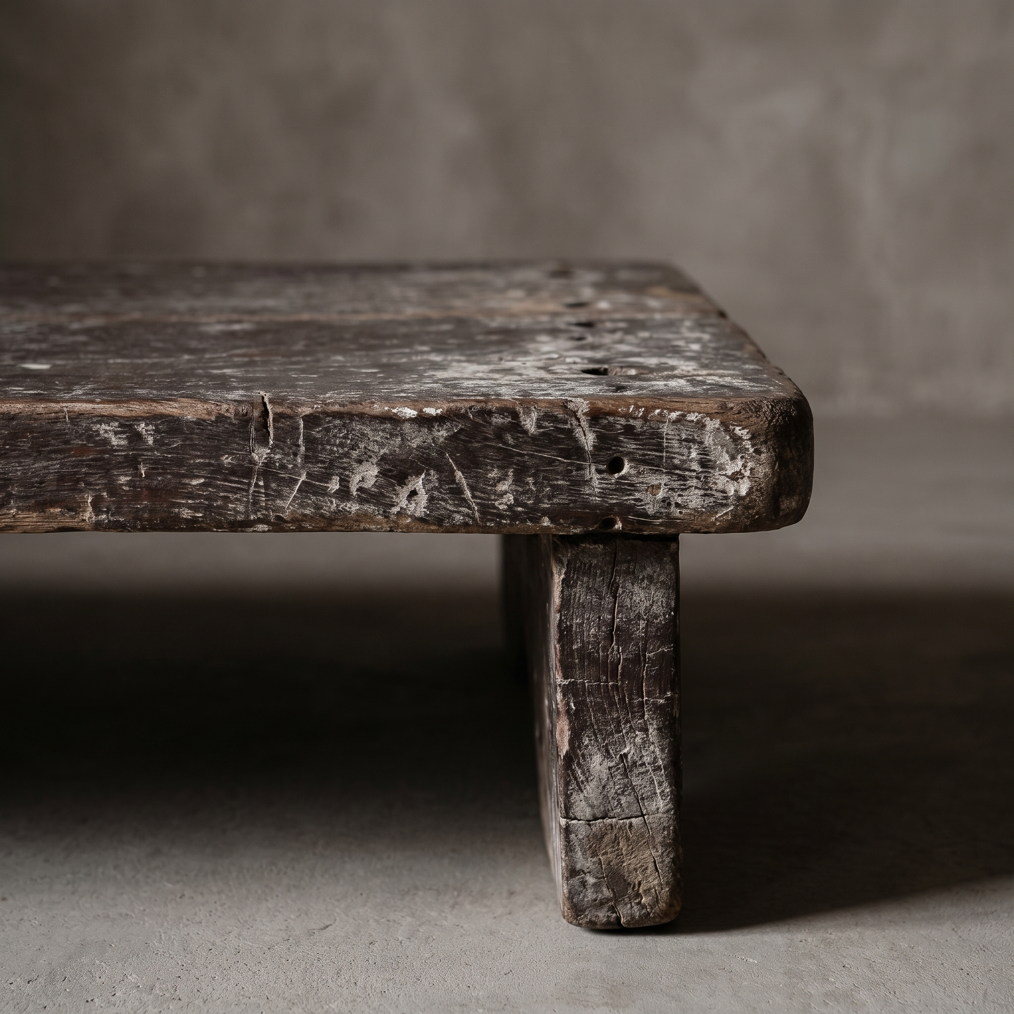 North India bajot detail, close-up of leg and plank-seam corner showing worn teak grain and distressed paint remnants