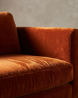 Close up detail of the burnt orange velvet nap and arm top edge