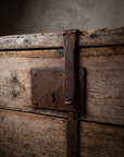 Detail of the antique pine trunk's iron lock plate and hasp strap