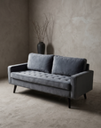 Dusk velvet track-arm loveseat, 45 degree three-quarter view showing full form and tufting