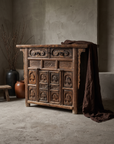Antique Tibetan hand-carved altar chest, lifestyle hero, greige plaster room