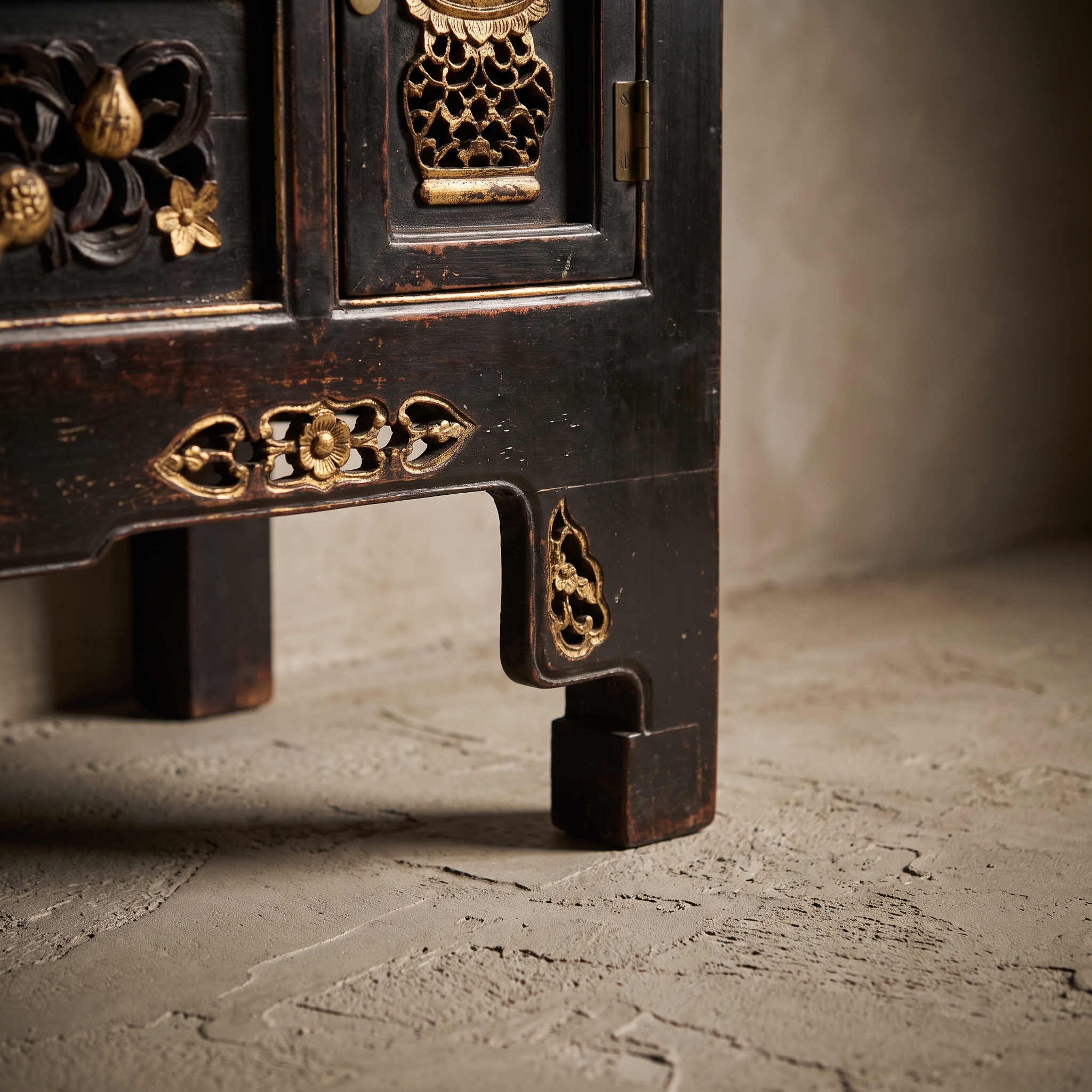 Second detail angle of the console's corner block foot and apron carving