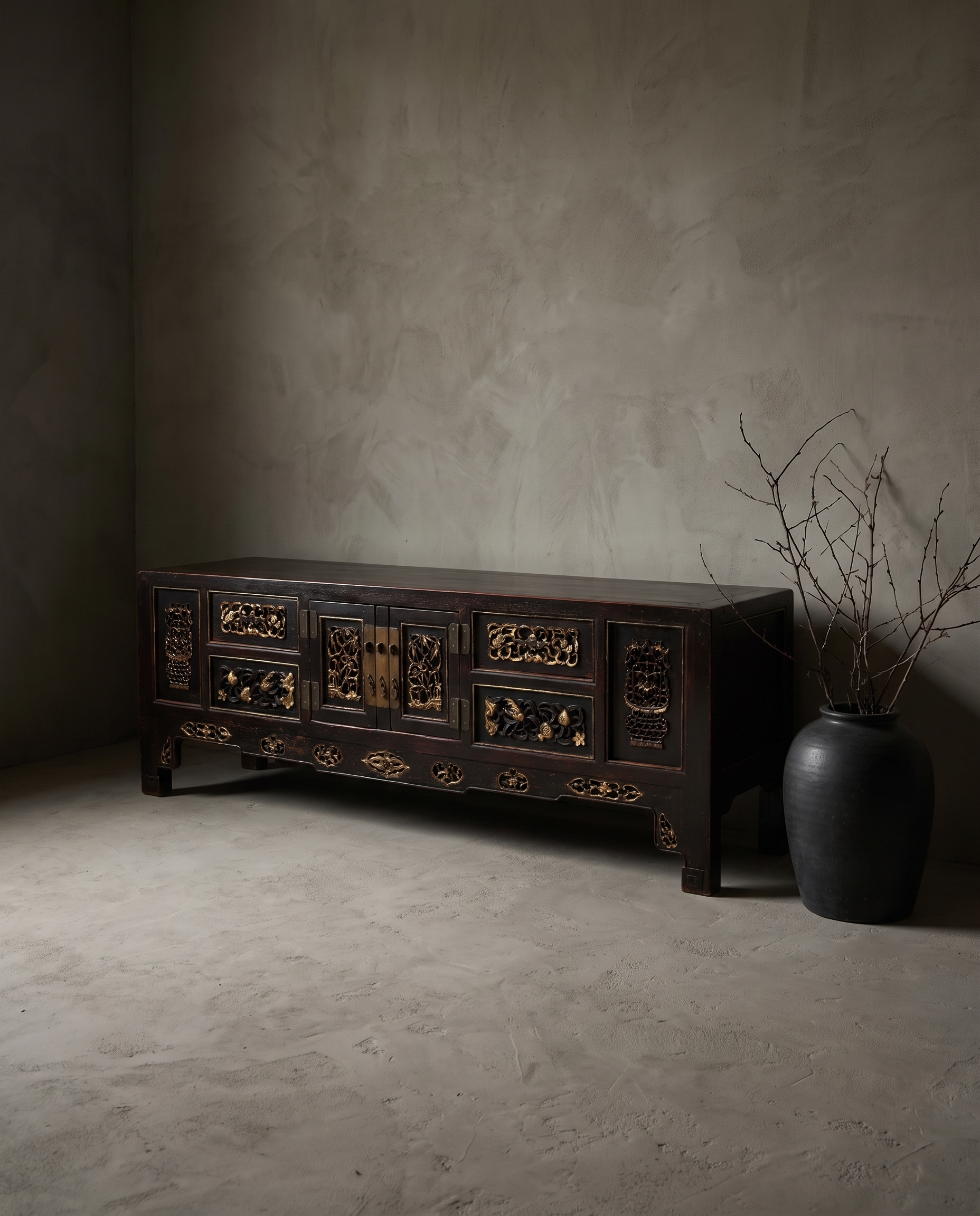 Antique Asian black lacquer console, tighter three-quarter view showing full form and carved construction