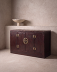 Antique Chinese oxblood lacquer cabinet, 45 degree three-quarter view, matte dark oxblood finish, true depth, perfectly flush plinth base