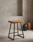 Onda Stool against raw plaster wall