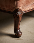 Close-up of the carved cabriole leg and pad foot