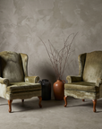 Wide symmetrical view of both wingback chairs facing forward
