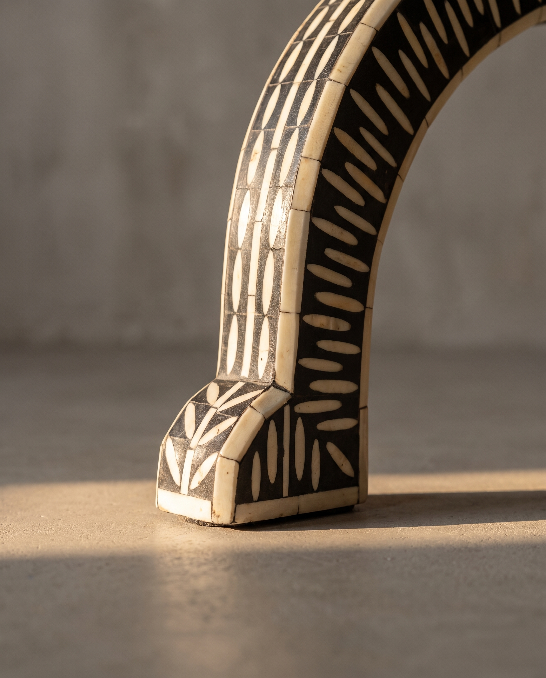 Macro detail of the flared bone inlay foot with striped banding