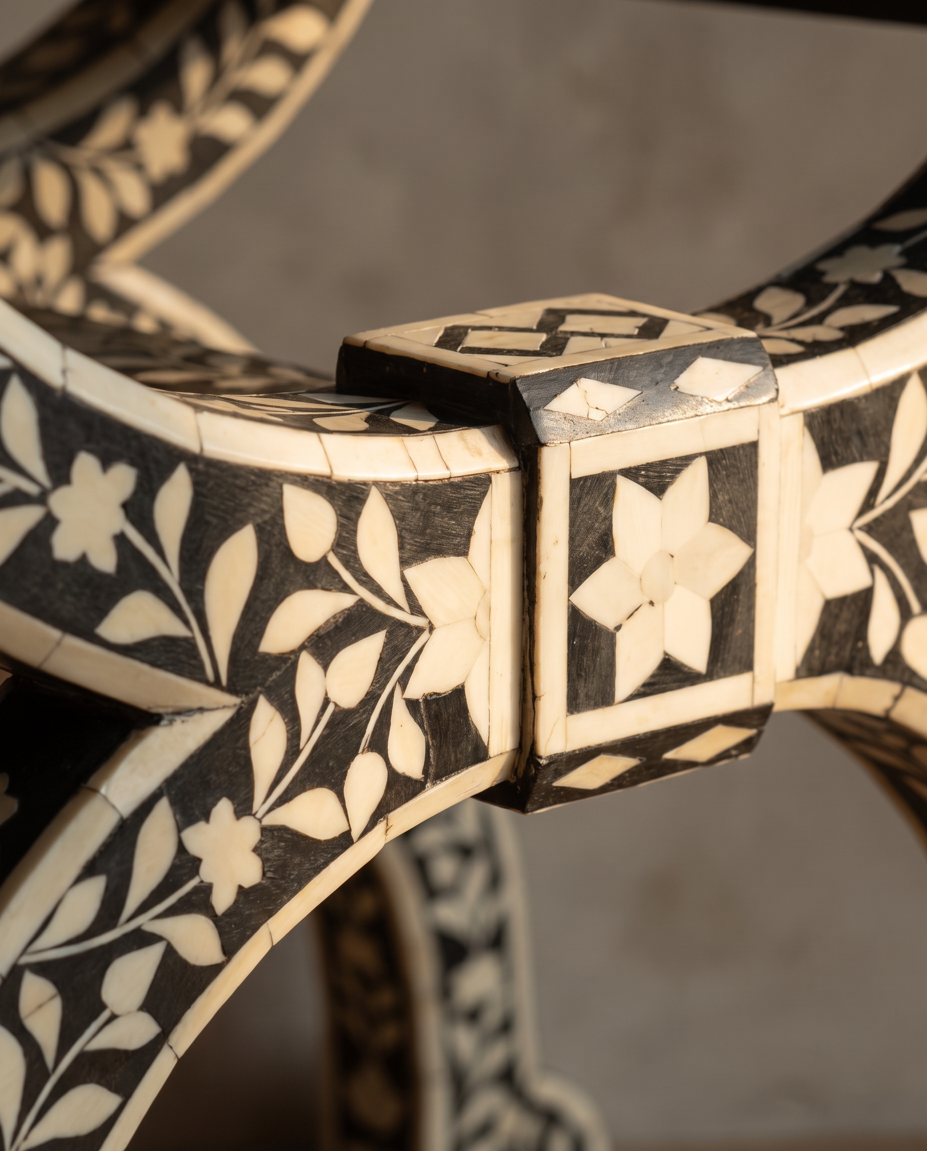 Second angle macro detail of the bone inlay joinery block and star medallion
