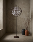 Crystal Orb floor lamp, three-quarter angle showing the iron orb frame and crystal chandelier