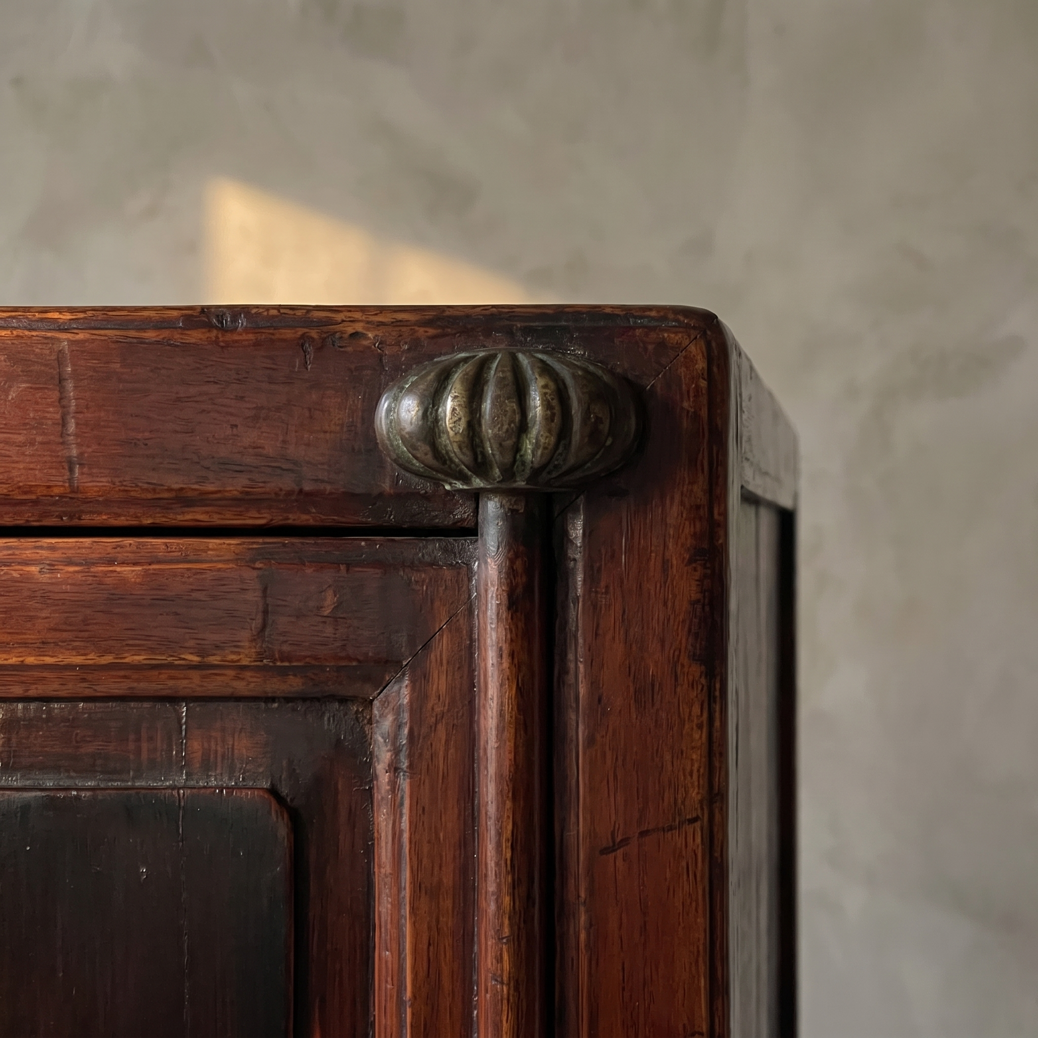 Macro detail of the fluted brass door pull, alternate light