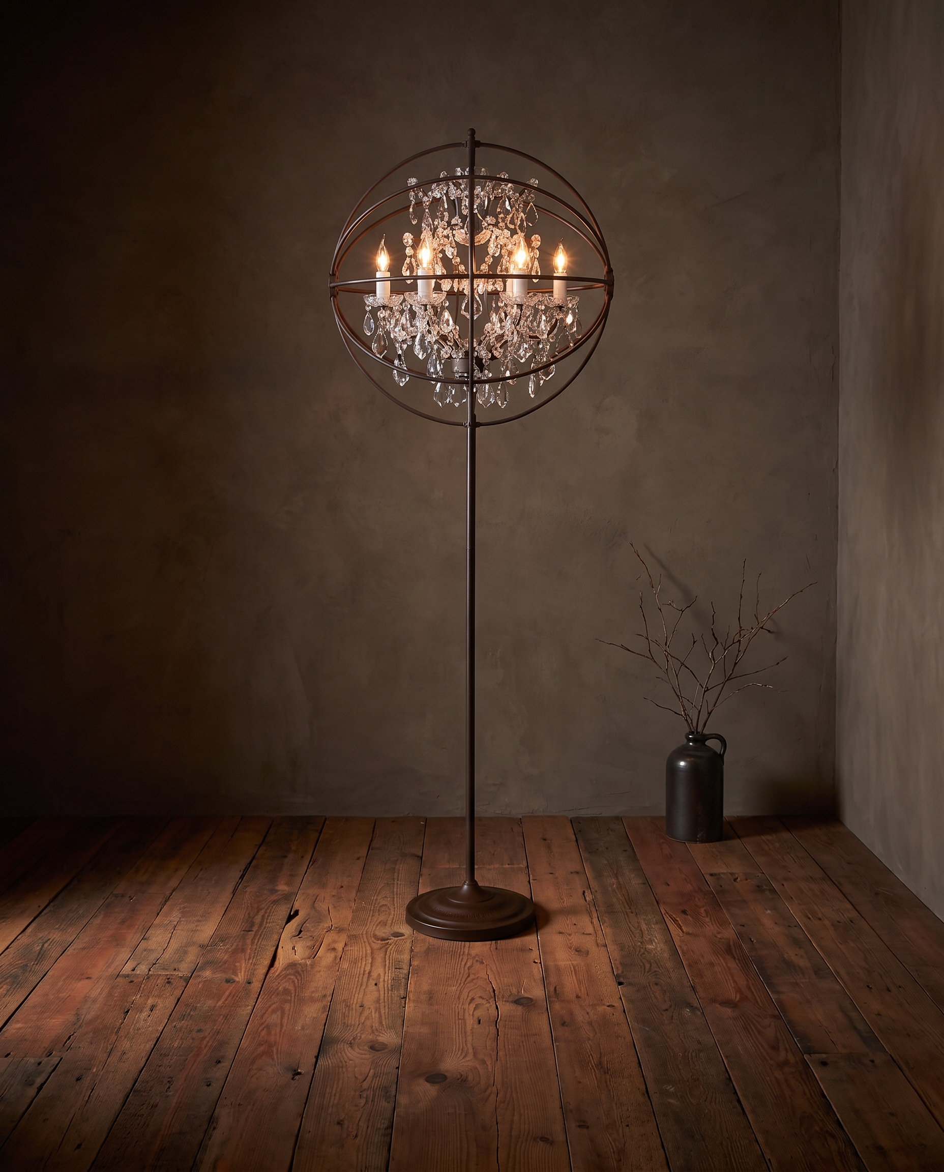 Gyro Crystal Floor Lamp by Timothy Oulton, three-quarter angle, glowing warm and sultry over rich reclaimed redwood floors
