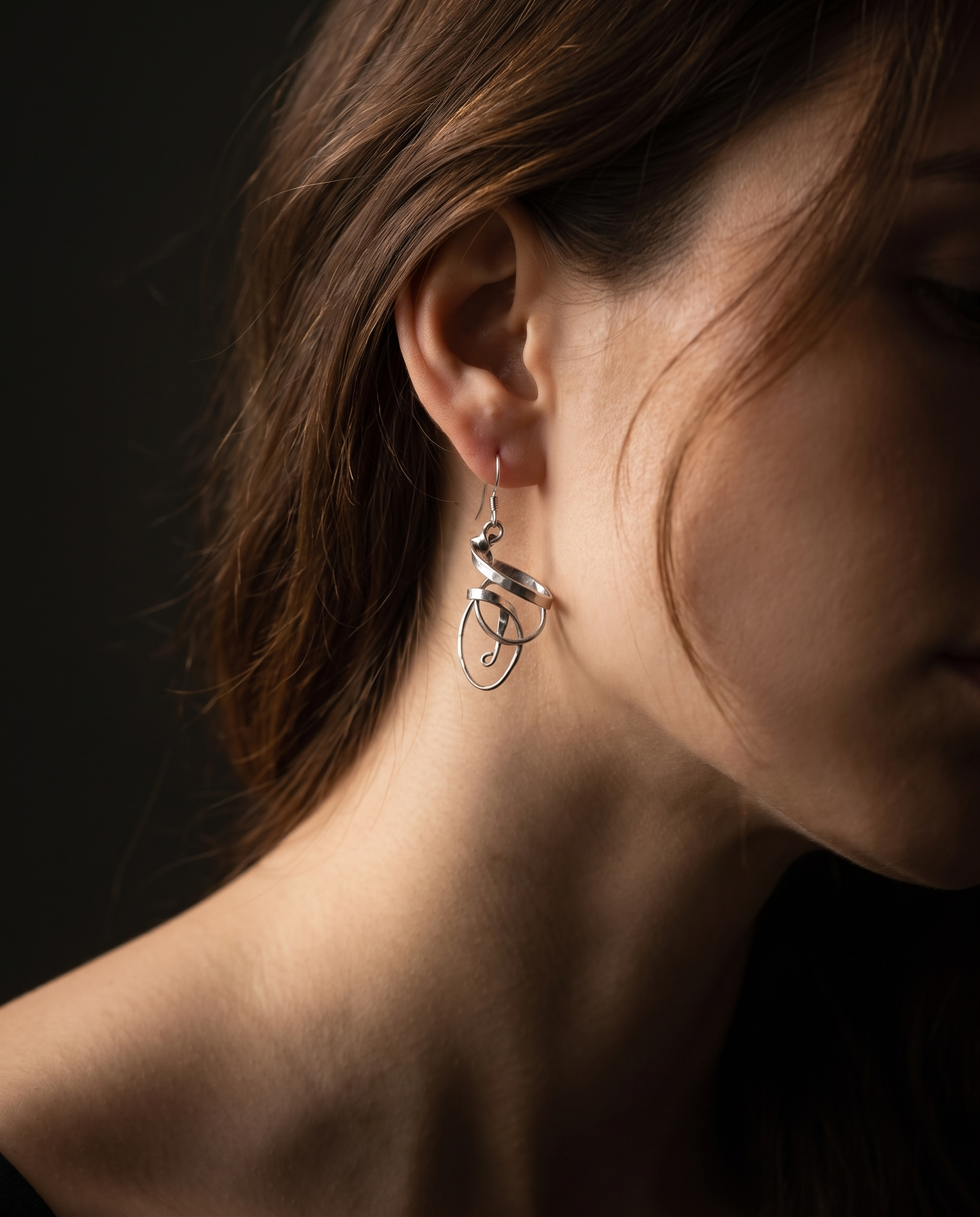Model wearing Twisted Ribbon Earrings