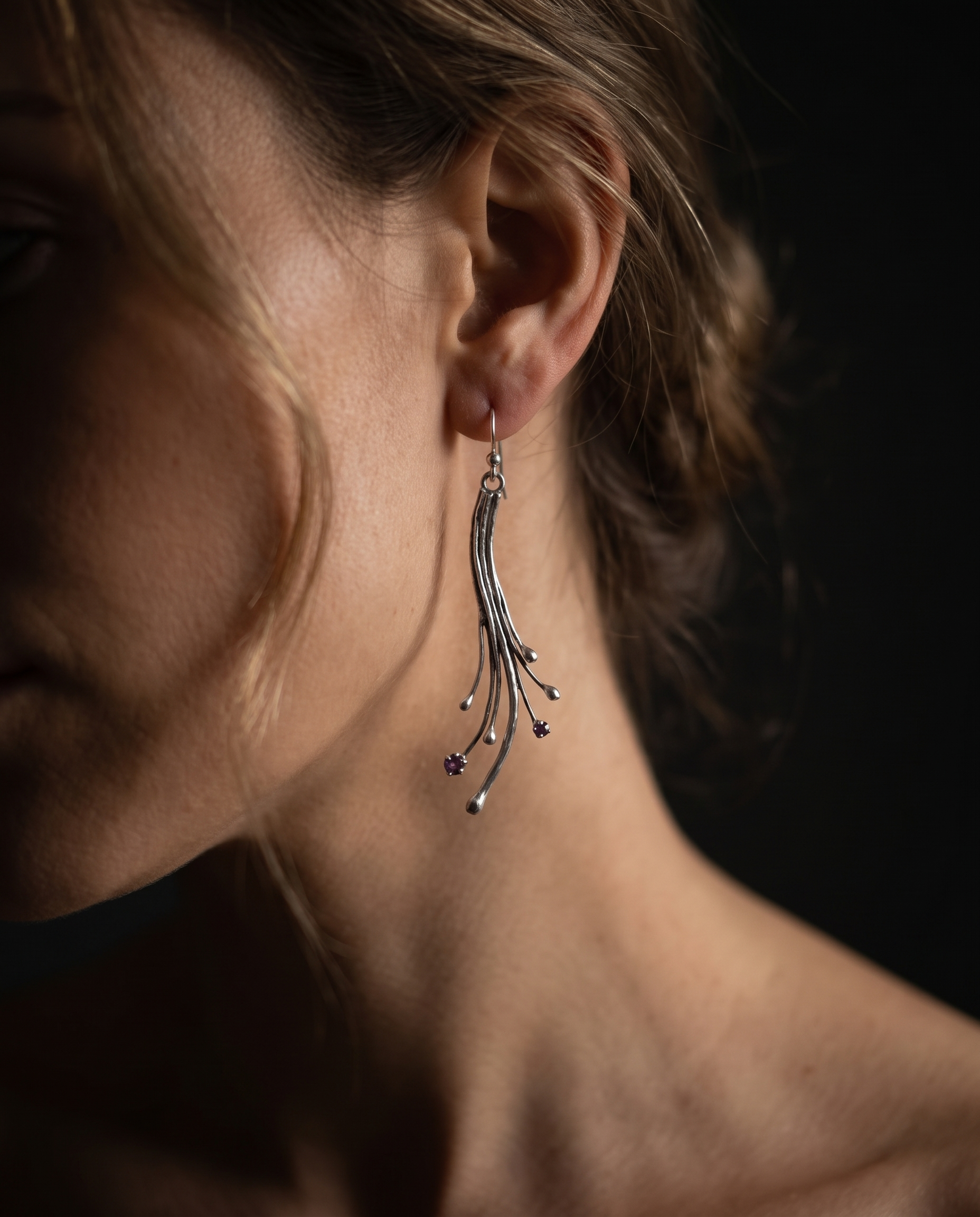 Model wearing Amethyst Comet Earrings